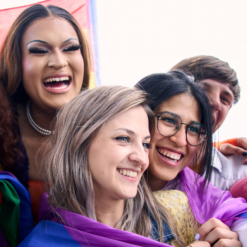 people posing for a picture at a pride event
