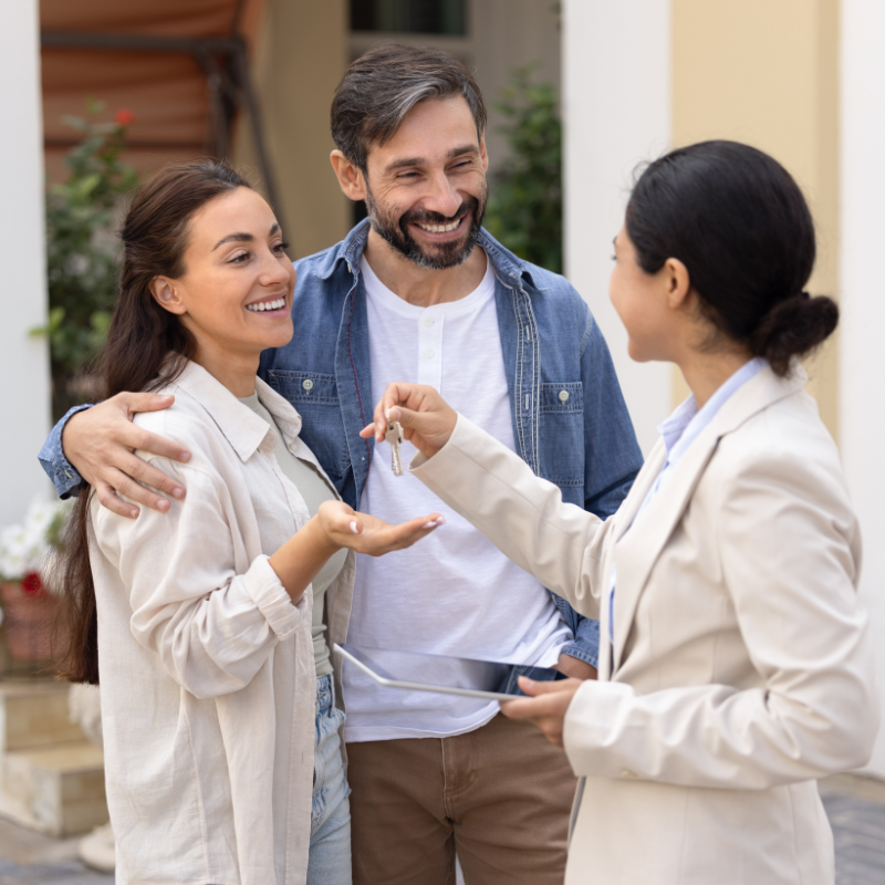 A couple getting the keys to their new home after getting a second chance certificate