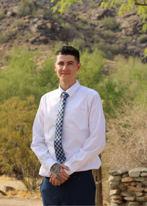Brayan Adonix G. wearing a dress shirt and tie