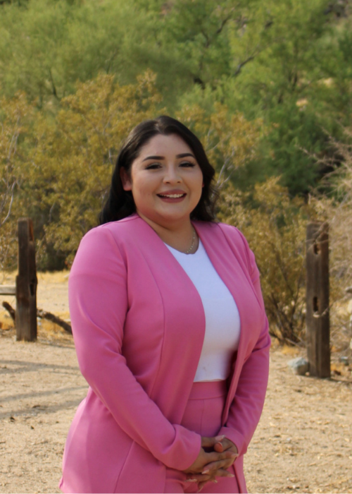 Gissele Moran M. wearing a pink suit posing for the camera