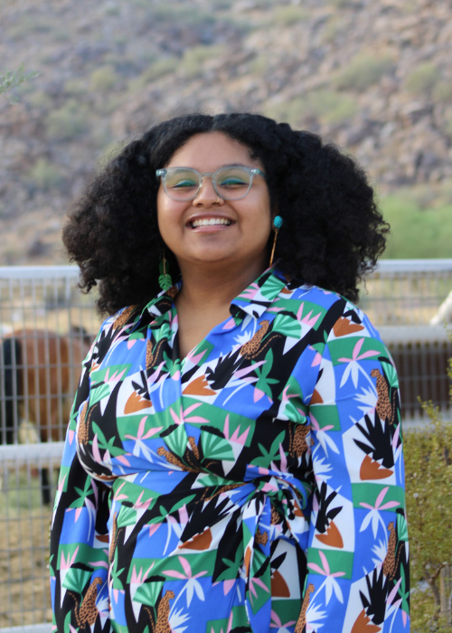 Guadalupe M. smiling for a photo outside