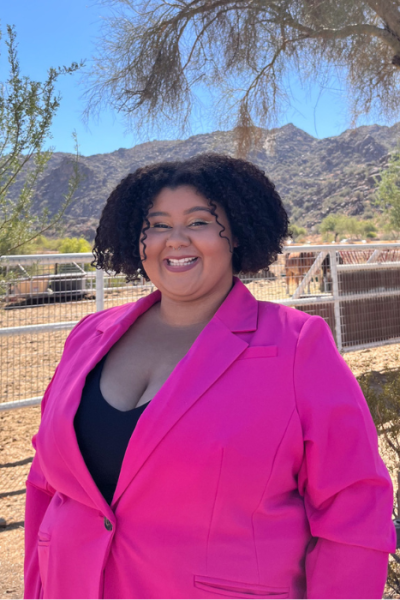 Olivia Milagro M. wearing a hot pink blazer outside